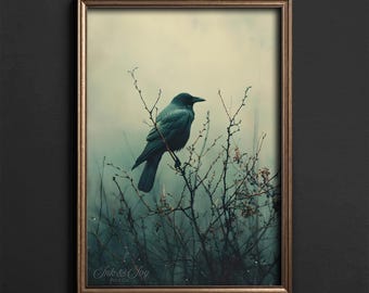May include: A framed print featuring a dark teal crow perched on a branch. The artwork has a muted color palette with a foggy background. The frame is a warm gold color. The text "Ink & Joy Print Co." is visible in the bottom left corner.