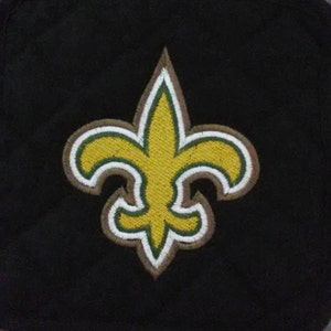 May include: A gold fleur-de-lis with green and white outlines on a black background.