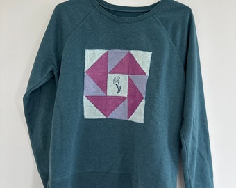 Hand quilted upcycled teal sweatshirt with hand stamped flower