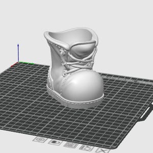 May include: A 3D-rendered, off-white boot-shaped planter. The boot features a rounded toe, laces, and a stitched design. The planter's opening is at the top, and it sits on a grid-like surface.