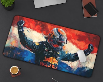 May include: A rectangular desk mat featuring a vibrant painting of a race car driver in a helmet, arms raised in victory. The background showcases the Dutch flag's red, white, and blue colors. A white computer mouse rests on the mat.
