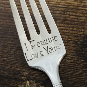 May include: A silver fork with the words "I Forking Love You" engraved on the handle.