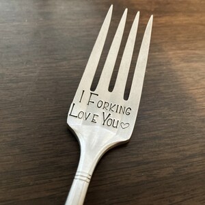 May include: A silver fork with the words "I Forking Love You" engraved on it.