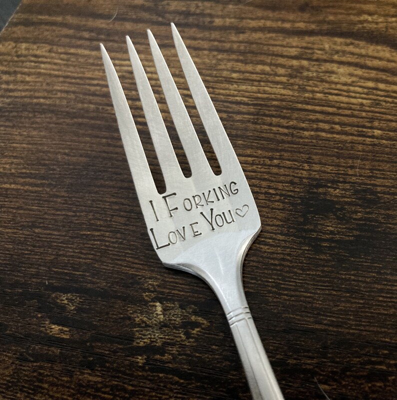 May include: A silver fork with the words "I Forking Love You" engraved on the handle.