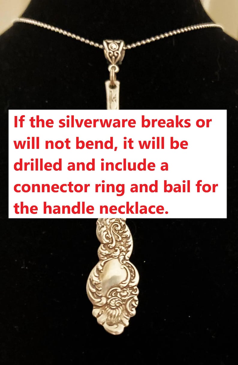 May include: Silver necklace featuring a spoon handle pendant with ornate floral detailing. The necklace has a fine chain and a decorative clasp. The image text reads: "If the silverware breaks or will not bend, it will be drilled and include a connector ring and bail for the handle necklace."