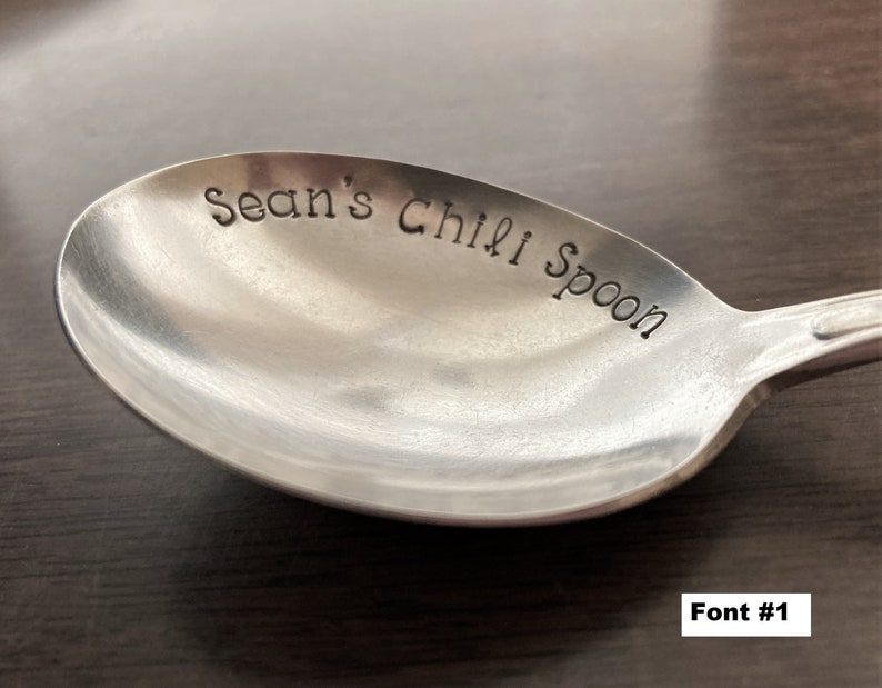 May include: A silver spoon with the words "Sean's Chili Spoon" engraved on the front.