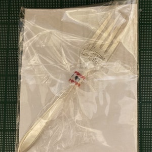 May include: A silver fork with a red and white beaded handle. The fork has the words "I ForKing Love You" engraved on the handle.