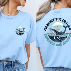 May include: Light blue t-shirt with a whale graphic and the text "Respect the Locals Protect Our Oceans".