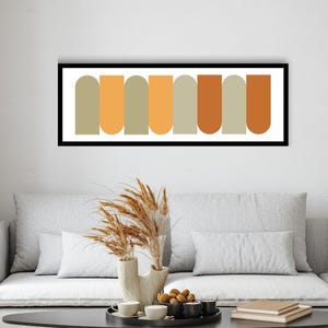 Pode incluir: Uma impressão de arte abstrata emoldurada com um design horizontal de formas arredondadas em tons de laranja, amarelo e cinza.