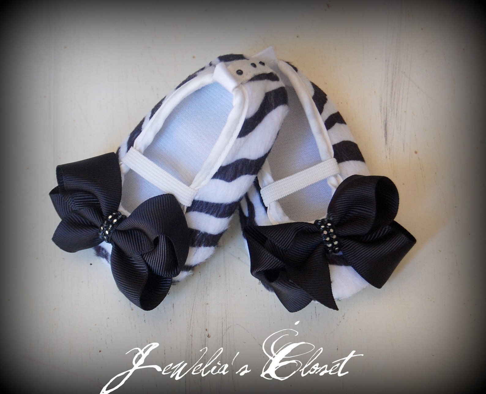 black and white zebra print ballet flat baby shoes with black grosgrain bows