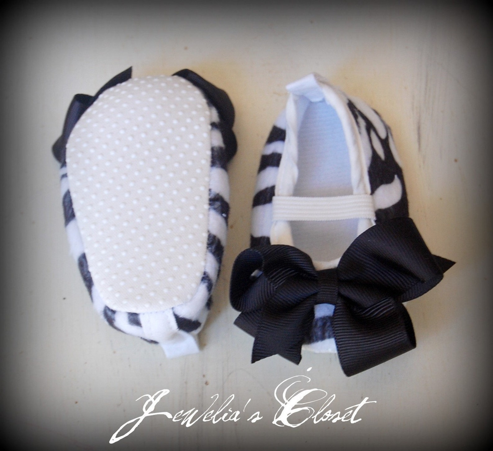 black and white zebra print ballet flat baby shoes with black grosgrain bows