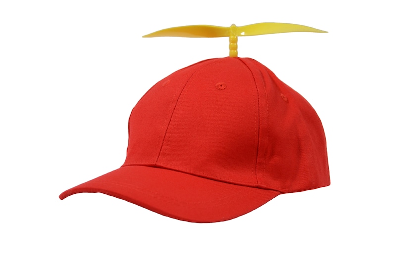 May include: A red baseball cap with a yellow propeller on top. The cap has a curved brim and a mesh back.