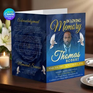 May include: A folded funeral program featuring a deep blue rose background, gold text, and a portrait of Thomas Robrrt. The front displays the text In Loving Memory, Thomas Robrrt, dates, and two white doves. The inside panel contains an acknowledgement.