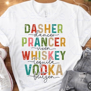 May include: White t-shirt with colorful text: "Dasher, Dancer, Prancer, Vixen, Whiskey, Tequila, Vodka, Blitzen." The text is in various colors and fonts. The shirt is paired with jeans and white sneakers.