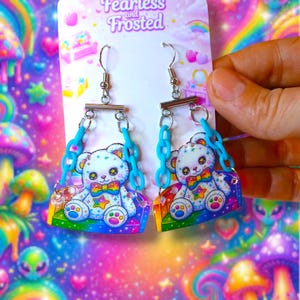 May include: A white ceramic mug with a black handle and the text "But First, Coffee" in a handwritten style. The mug is on a white surface. The mug is 4 inches tall.