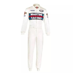 May include: White racing suit with long sleeves and a collar. The suit features the "MARTINI RACING" logo in red, blue, and white across the chest, along with sponsor patches. The suit has a front zipper and a belt at the waist.