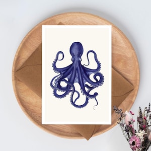 May include: A rectangular greeting card featuring a detailed illustration of a deep blue octopus centred on a cream-coloured background. The octopus is depicted with its tentacles spread outward, showcasing the suckers along the underside of each arm.