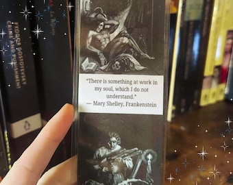 May include: A rectangular bookmark featuring black and white illustrations of scenes from Frankenstein. The center white panel contains the text: There is something at work in my soul, which I do not understand. — Mary Shelley, Frankenstein.