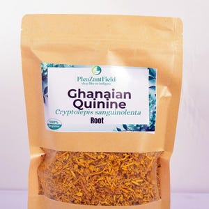 May include: A brown paper bag filled with dried, orange-yellow roots. The bag has a label with the text "Ghanaian Quinine" and "Cryptolepis sanguinolenta Root." The label also includes the text "100% Organic."