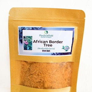 May include: A kraft paper bag with a clear window, filled with dried stem bark. The bag features a label with the text "African Border Tree" and "Stem Bark". The label also includes a small image of a plant and the words "100% Organic".