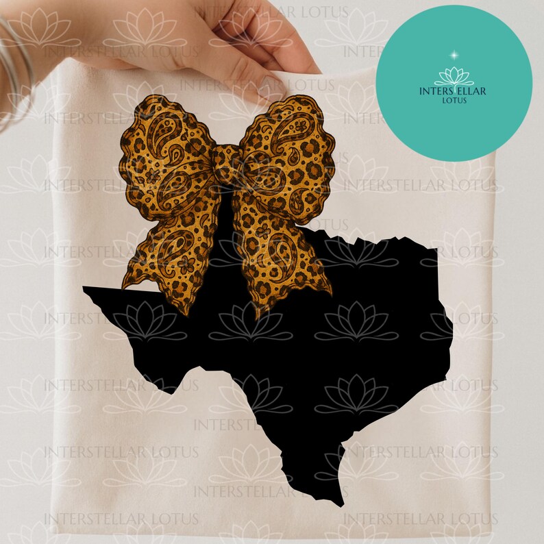 May include: A cream-colored fabric with a black Texas outline and a large bow. The bow features a leopard print design with paisley accents. The image also includes a teal circle with the text "INTERSTELLAR LOTUS".
