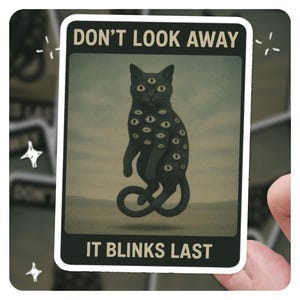 Don’t Look Away Cat Sticker – Surreal Eyeball Horror Cat Art, “It Blinks Last” Creepy Aesthetic Vinyl