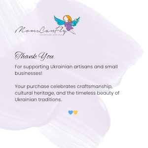 May include: White background with text and a cartoon illustration. The text reads "Moms CanFly" and "Thank You". The image also includes the text "For supporting Ukrainian artisans and small businesses!" and "Your purchase celebrates craftsmanship, cultural heritage, and the timeless beauty of Ukrainian traditions."