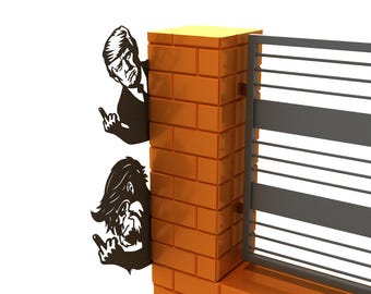 May include: Two black silhouette figures of people giving the middle finger, peeking around a brick wall and a metal gate. The figures are cut out and mounted on the wall.