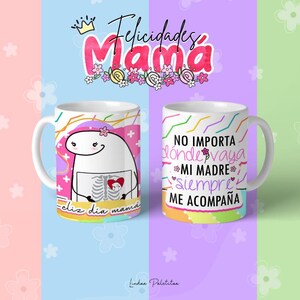 May include: Two white ceramic mugs with colourful designs. One mug features a cartoon character with a heart and the text "feliz dia mama". The other mug has the text "NO IMPORTA donde vaya MI MADRE siempre ME ACOMPA&Ntilde;A".
