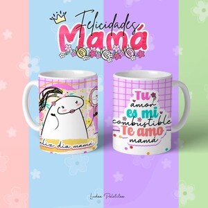 May include: Two white ceramic mugs with pink and purple designs. One mug features a cartoon character with the text "Feliz dia mama". The other mug has the text "Tu amor es mi combustible Te amo mama".