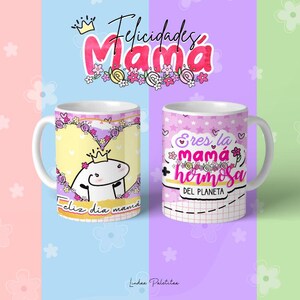 May include: Two white ceramic mugs with pink and purple floral designs. One mug says "Feliz dia mama" and the other says "Eres la mama hermosa del planeta".