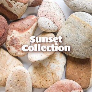 May include: A collection of smooth, rounded stones in various shades of brown, tan, and white. The stones have unique patterns and textures. The text "Sunset Collection" is displayed in white across the image.