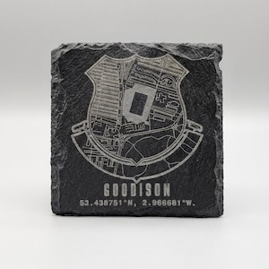 May include: A square, black slate coaster featuring a detailed map of Goodison Park stadium, with the word "GOODISON" and coordinates etched below. The map and text are a lighter color, contrasting the dark slate.
