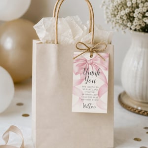 May include: A beige gift bag with a brown handle and a tag that says "Thank You." The tag has a pink bow design and the text "FOR COMING TO MY PARTY AND FOR THE AWESOME GIFT I HAD THE BEST BIRTHDAY EVER!" The name "Willow" is at the bottom.