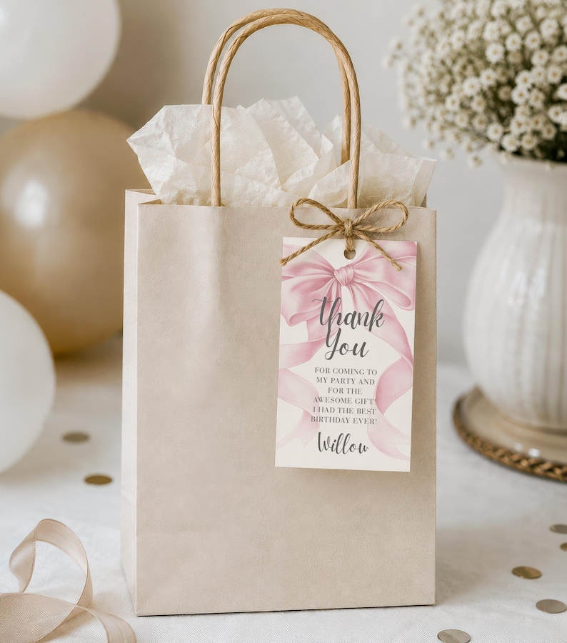 May include: A beige gift bag with a brown handle and a tag that says "Thank You." The tag has a pink bow design and the text "FOR COMING TO MY PARTY AND FOR THE AWESOME GIFT I HAD THE BEST BIRTHDAY EVER!" The name "Willow" is at the bottom.