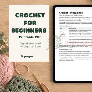 May include: A digital crochet guide titled Crochet for Beginners Printable PDF with 9 pages. The document displays instructions for gathering a starter kit and learning steps. A tablet screen shows the text clearly alongside a ball of yarn and a hook.