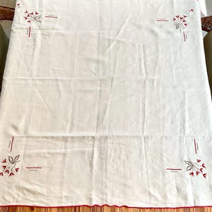 1950s Red and Ivory Linen Square Embroidered Tablecloth; no stains, holes, or visible wear; trimmed in red embroidery; 44x44 inch square