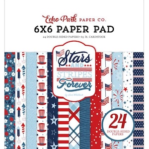 May include: A 6x6 inch paper pad with a patriotic theme. The cover features the text "Stars and Stripes Forever" and a variety of red, white, and blue patterned papers. The pad contains 24 double-sided papers.