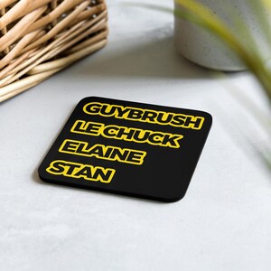 May include: Black square coaster with the names "Guybrush", "LeChuck", "Elaine", and "Stan" written in yellow.
