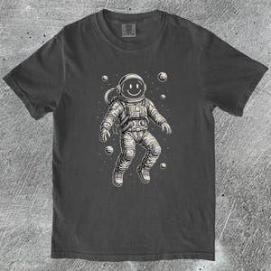 Astronaut Graphic T-Shirt, Cosmic Space Tee, Cool Galaxy Top, Unisex Shirt, Gift for Space Lovers, Astronaut Shirt