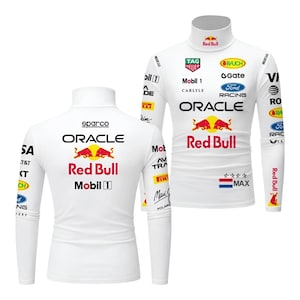 May include: White long-sleeved turtleneck shirt with various sponsor logos and the Red Bull logo. The shirt has a racing theme, with the Oracle and Mobil 1 logos. The design includes the text "MAX" and a flag.