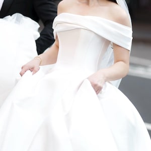 Off Shoulder Satin Wedding Dress – Ball Gown Silhouette – Corset Bodice – Structured Bridal Look – Romantic Train – Fairytale Princess Gown