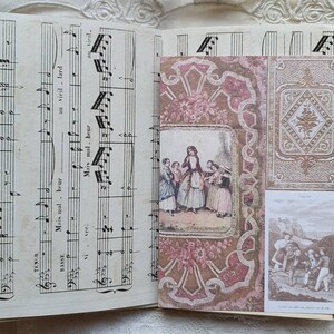 May include: An open vintage music book with a decorative paper cover. The cover features a pink and brown floral pattern with a gold border. The book is open to a page with sheet music and the words "Mais mal - heur" and "au vieil - lard" written in French.