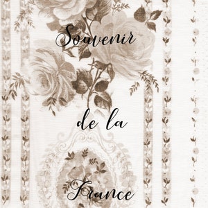 May include: A white fabric with a brown floral pattern and the text "Souvenir de la France".