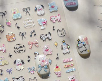 May include: A sheet of nail art stickers featuring various designs, including puppies, bears, bows, musical notes, and the word "Love". The stickers are in pastel colors with glitter accents. Two nails are painted with matching puppy designs.