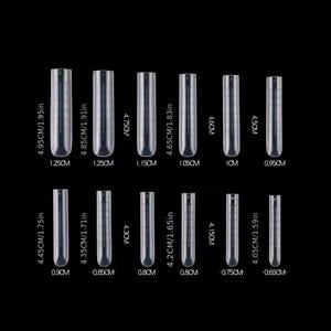May include: A set of 12 clear plastic nail tips in various sizes. The tips are arranged in two rows, with the largest tips at the top and the smallest tips at the bottom. The tips are labeled with their size in centimeters and inches.