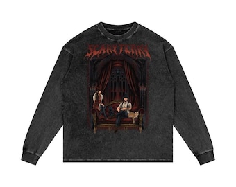 May include: Black long-sleeve t-shirt with a vintage wash. The shirt features a graphic print of a gothic scene with the text "Scary Fairy" in red.