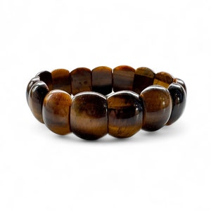 May include: A brown tiger's eye stone bracelet with rounded beads.