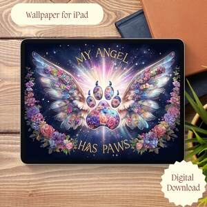 May include: iPad wallpaper featuring a paw print with angel wings, filled with colorful flowers. The text "MY ANGEL HAS PAWS" is displayed. The design is surrounded by a floral wreath, with the words "Wallpaper for iPad" at the top.