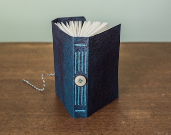 Sturdy little notebook with cave paper covers